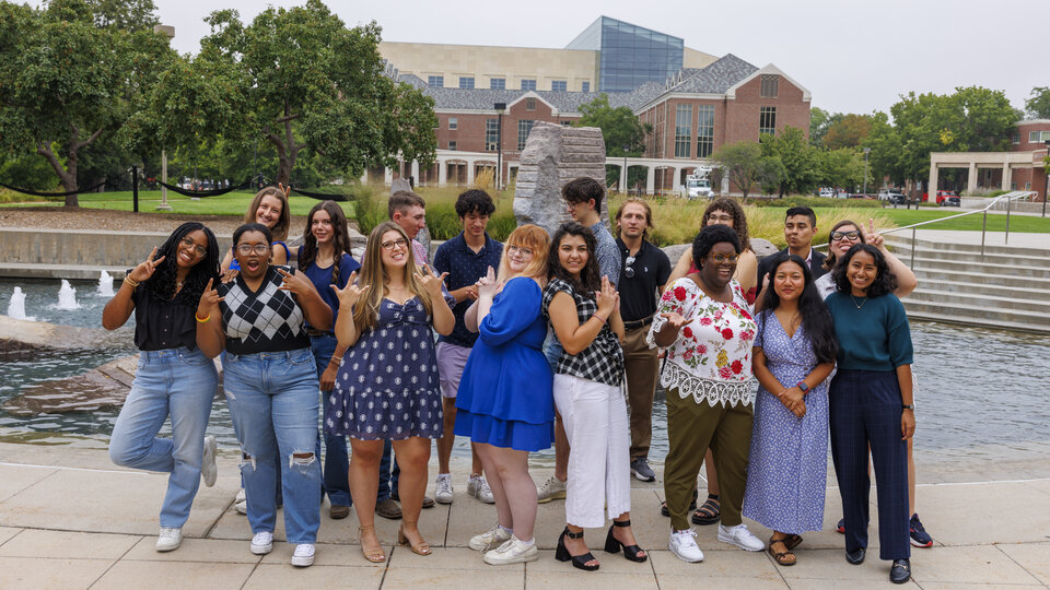 Hall Government officers posing in front of Nebraska Union fountain